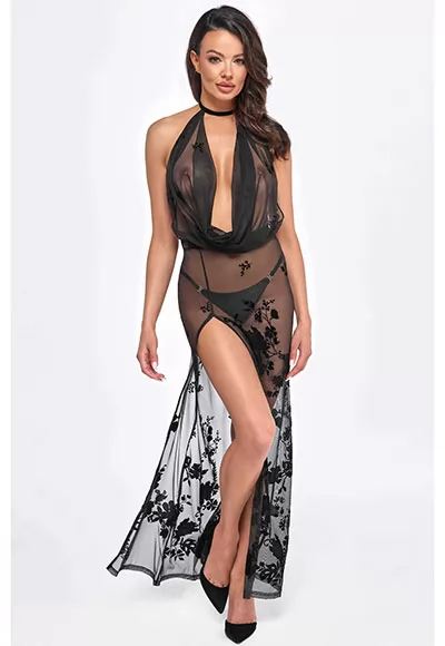 This sheer flocked mesh maxi dress combines charm and elegance. This sexy dress has many assets: with its fully open back, its luxurious velvet trim at the lower back, its velvet collar, its sexy slit at the legs, not to mention its captivating and fluid draped neckline, prepare to be hypnotized.  Whether it's a naughty evening or an offbeat fashion...